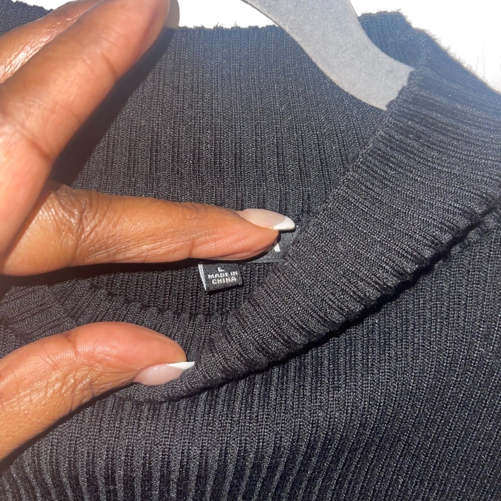 Black Sweater with peak-a-boo sleeves.